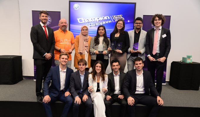 Group of 12 students gathered celebrating winning a competition